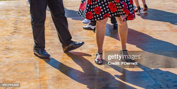 older rock and roll dancers with partners at annual solstice italian festival - rock'n roll imagens e fotografias de stock