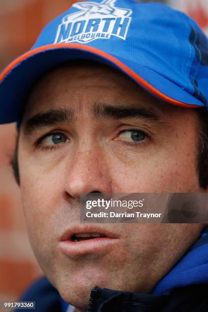 Brad Scott, Senior Coach of the Kangaroos speaksd to the media before a North Melbourne Kangaroos AFL training session at Arden Street Ground on July...