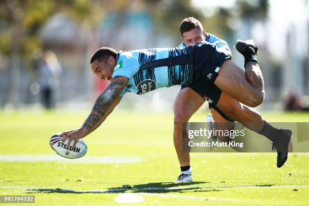 Tyson Frizell dives in front of Tariq Sims during a New South Wales Blues State of Origin training session at NSWRL Centre of Excellence Field on...