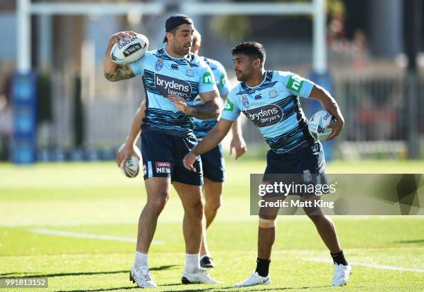 Paul Vaughan and Tyrone Peachey take part in a drill during a New South Wales Blues State of Origin training session at NSWRL Centre of Excellence...