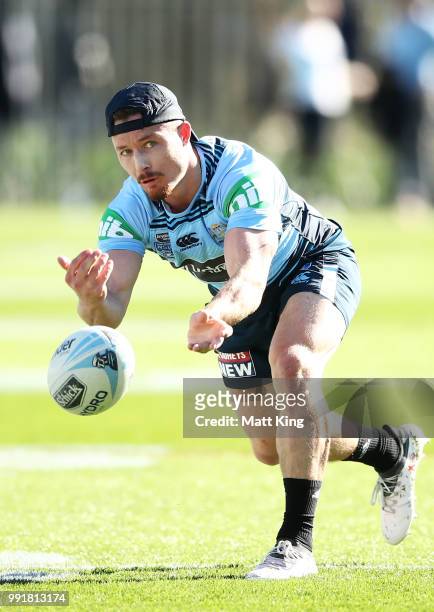 Damien Cook passes during a New South Wales Blues State of Origin training session at NSWRL Centre of Excellence Field on July 5, 2018 in Sydney,...