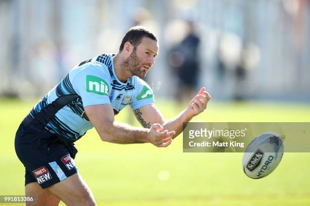 Boyd Cordner passes during a New South Wales Blues State of Origin training session at NSWRL Centre of Excellence Field on July 5, 2018 in Sydney,...