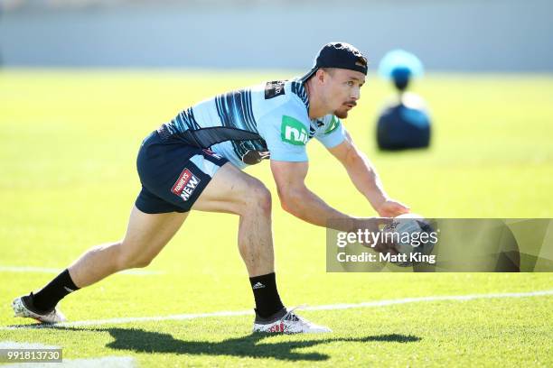 Damien Cook passes during a New South Wales Blues State of Origin training session at NSWRL Centre of Excellence Field on July 5, 2018 in Sydney,...