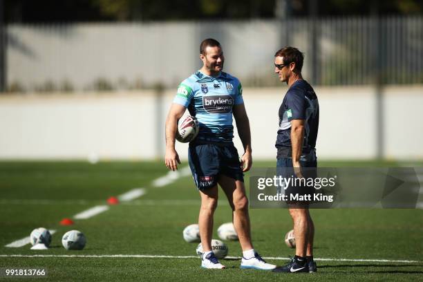Boyd Cordner talks to Andrew Johns during a New South Wales Blues State of Origin training session at NSWRL Centre of Excellence Field on July 5,...