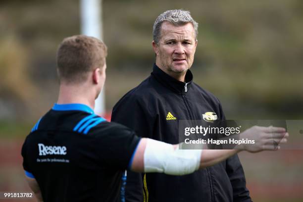 James O'Reilly talks to assistant coach Richard Watt during a Hurricanes Super Rugby training session at Rugby League Park on July 5, 2018 in...