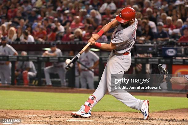 Matt Carpenter of the St. Louis Cardinals doubles in the fifth inning of the MLB game against the Arizona Diamondbacks at Chase Field on July 4, 2018...