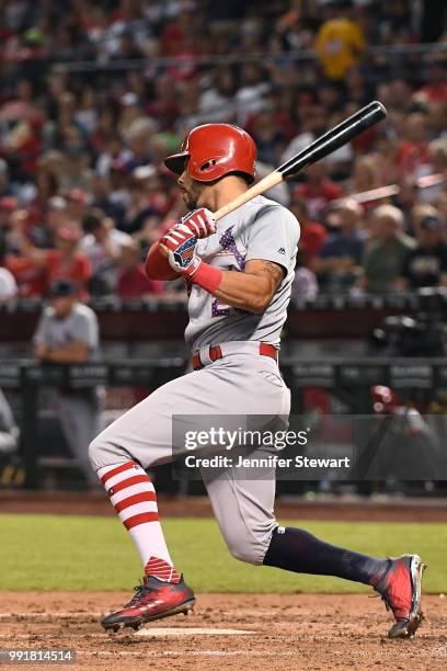 Tommy Pham of the St. Louis Cardinals hits an RBI single during the fifth inning of the ML B game against the Arizona Diamondbacks at Chase Field on...