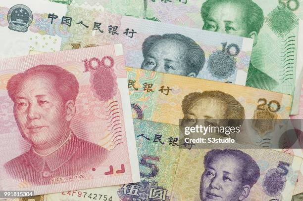 Banknotes of Renminbi arranged for photography on July 03 2018 in Hong Kong, Hong Kong. The Chinese yuan has been slumping for the past eight days...