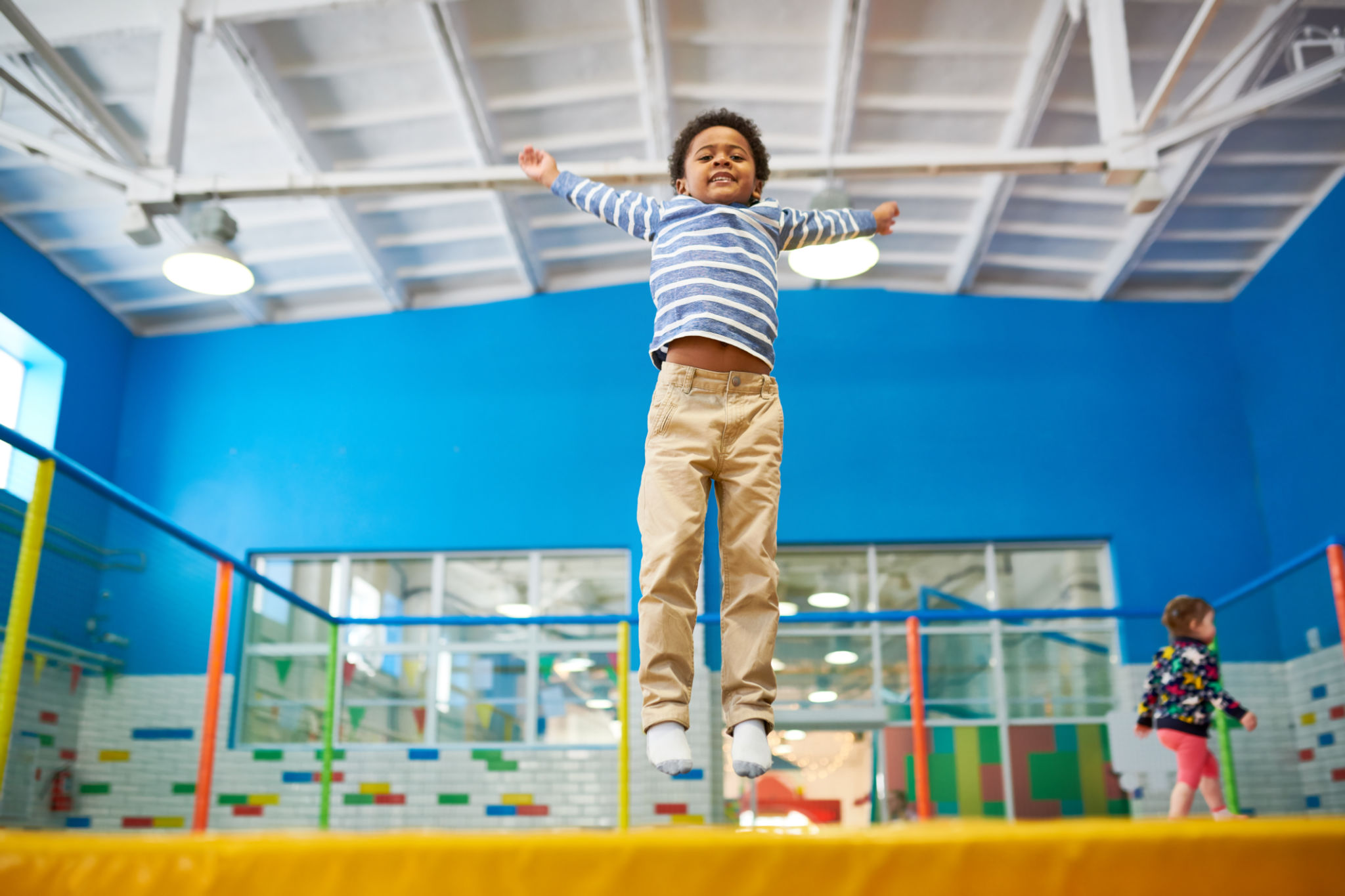 African-American Boy Enjoying Trampolines African-American Boy Enjoying Trampolines