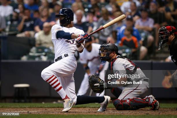 Keon Broxton of the Milwaukee Brewers hits a double in the fifth inning against the Minnesota Twins at Miller Park on July 2, 2018 in Milwaukee,...