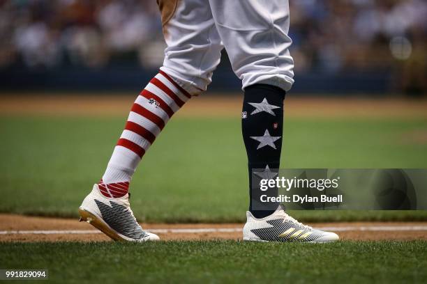 Detail view of the Independence Day themed socks and cleats worn by Keon Broxton of the Milwaukee Brewers during the game against the Minnesota Twins...