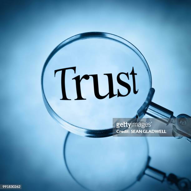 magnifying glass with the word trust magnified - respect word stock pictures, royalty-free photos & images