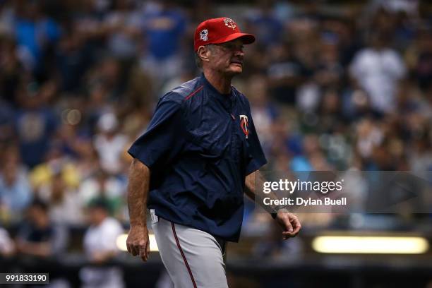 Manager Paul Molitor of the Minnesota Twins walks across the field in the tenth inning against the Milwaukee Brewers at Miller Park on July 2, 2018...