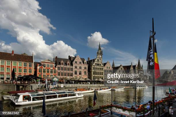 ghent and lei river on a fair day, old houses and river boats, flanders, belgium - 東フランダース ストックフォトと画像