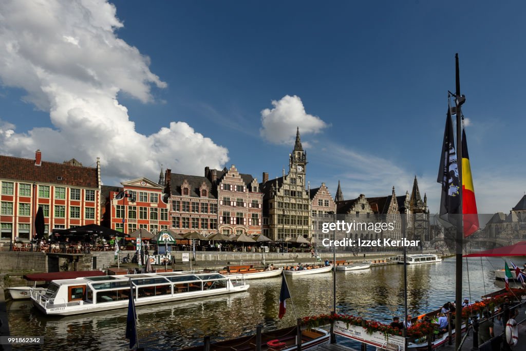 Ghent and Lei river on a fair day, old houses and river boats, Flanders, Belgium