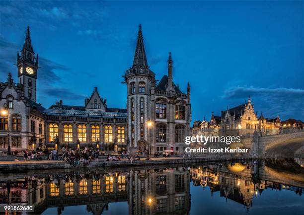 view of ghent, the flemish city of belgium and its historical buidings at the blue hour - cultura europea occidentale foto e immagini stock