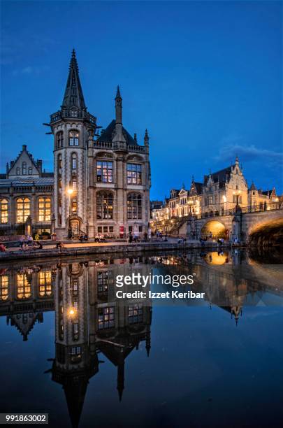 view of ghent,flanders,  the flemish city of belgium and its historical buidings  reflected on the river at the blue hour - east flanders stock pictures, royalty-free photos & images
