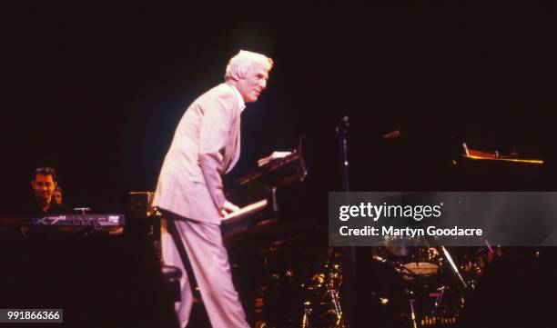 American composer, songwriter, record producer, pianist, and singer Burt Bacharach performs on stage at the Royal Festival Hall, London, 1998.