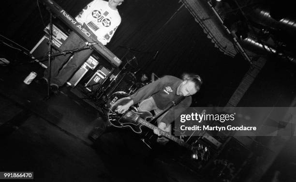 English singer, songwriter, composer, multi-instrumentalist and record producer Peter Hook performs on stage with Revenge, United Kingdom, 1990.