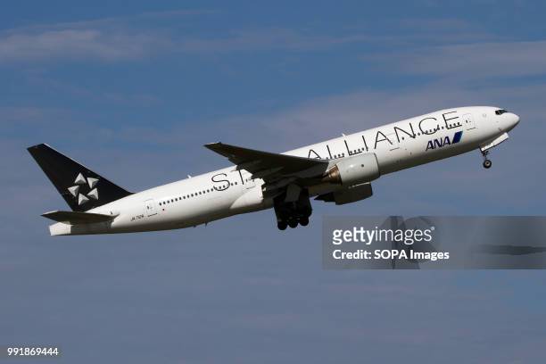 All Nippon Airways Boeing 777-200 in Star Alliance livery taking off from Tokyo Haneda airport.
