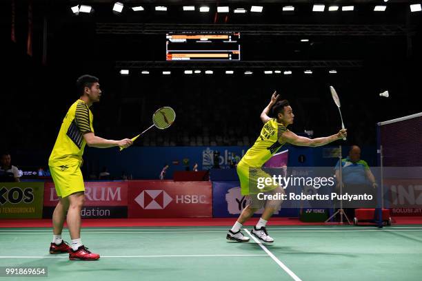 Liu Cheng and Zhang Nan of China compete against Huang Kaixiang and Wang Yilyu of China during the Men's Doubles Round 2 match on day three of the...