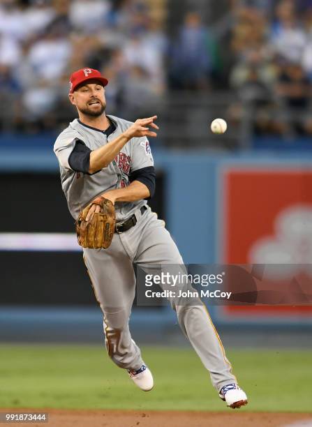 Jordy Mercer of the Pittsburgh Pirates makes a throw to first base in the second inning against the Los Angeles Dodgers at Dodger Stadium on July 2,...