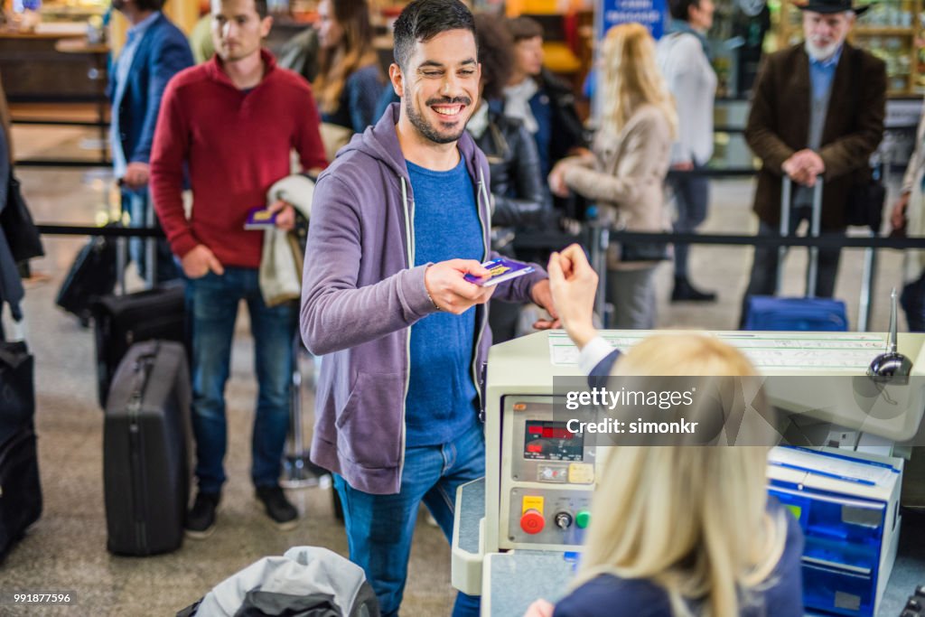 Businessman with passport at airport