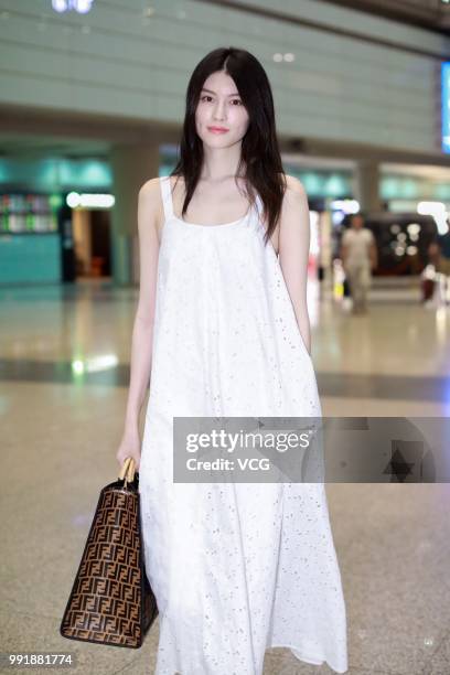 Fashion model Sui He is seen at Beijing Capital International Airport on July 2, 2018 in Beijing, China.