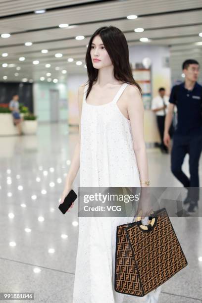 Fashion model Sui He is seen at Beijing Capital International Airport on July 2, 2018 in Beijing, China.