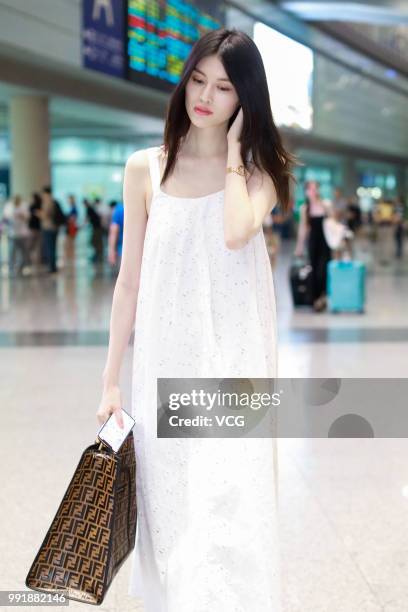 Fashion model Sui He is seen at Beijing Capital International Airport on July 2, 2018 in Beijing, China.