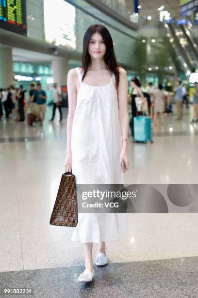 Fashion model Sui He is seen at Beijing Capital International Airport on July 2, 2018 in Beijing, China.