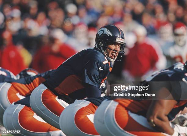 John Elway, Quarterback for the Denver Broncos calls the play on the line of scrimmage during the American Football Conference West game against the...