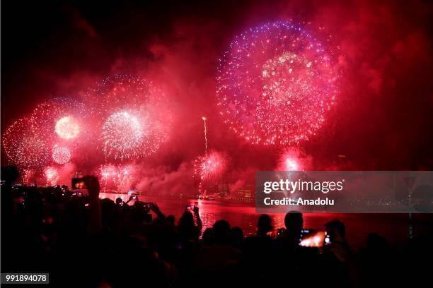 People watch Fourth of July fireworks from Gantry Plaza State Park in Queens, United States on July 4, 2018.