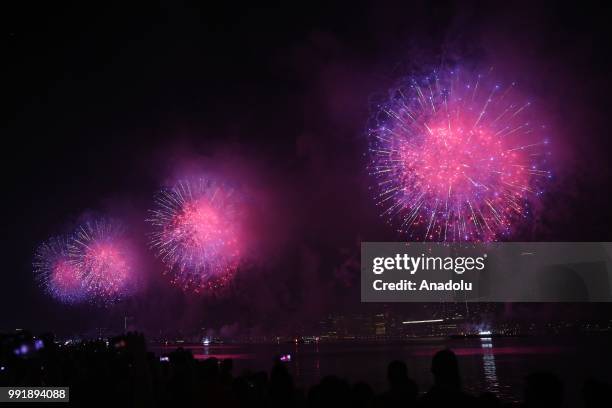 People watch Fourth of July fireworks from Gantry Plaza State Park in Queens, United States on July 4, 2018.