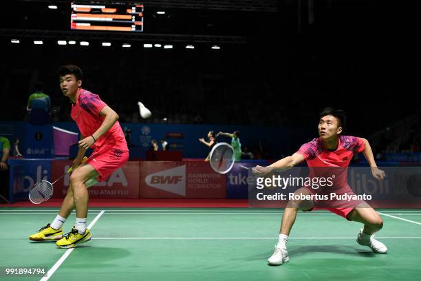 Huang Kaixiang and Wang Yilyu of China compete against Liu Cheng and Zhang Nan of China during the Men's Doubles Round 2 match on day three of the...