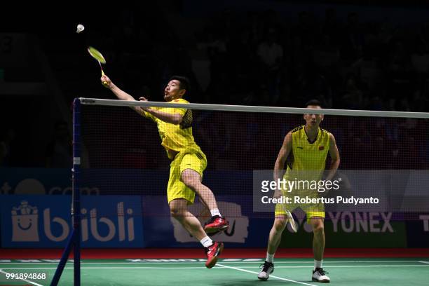 Liu Cheng and Zhang Nan of China compete against Huang Kaixiang and Wang Yilyu of China during the Men's Doubles Round 2 match on day three of the...
