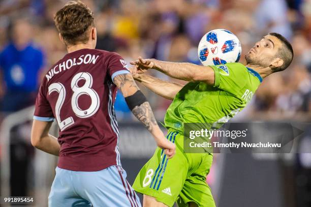 Victor Rodriguez of Seattle Sounders controls the ball against Sam Nicholson of Colorado Rapids at Dick's Sporting Goods Park on July 4, 2018 in...