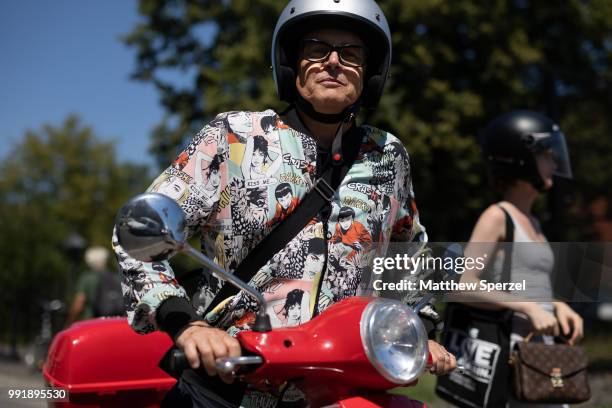 Guest is seen attending Rebekka Ruetz wearing a comic print shirt during the Berlin Fashion Week July 2018 on July 4, 2018 in Berlin, Germany.