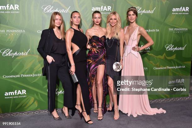 Masha Hanson, Kristina Romanova attend the amfAR Paris Dinner 2018 at The Peninsula Hotel on July 4, 2018 in Paris, France.