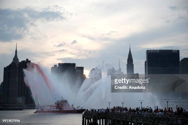 Fire boat puts on a water show during the Independence Day celebrations at the East River in New York, United States on July 4, 2018.