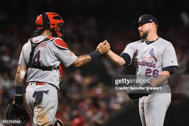 Bud Norris and Yadier Molina of the St. Louis Cardinals celebrate the win over the Arizona Diamondbacks at Chase Field on July 4, 2018 in Phoenix,...