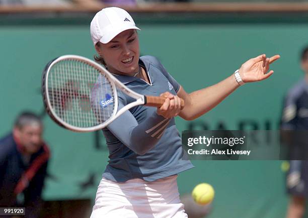 Martina Hingis of Switzerland returns in her fourth round match against Sandrine Testud of France during the French Open Tennis at Roland Garros,...