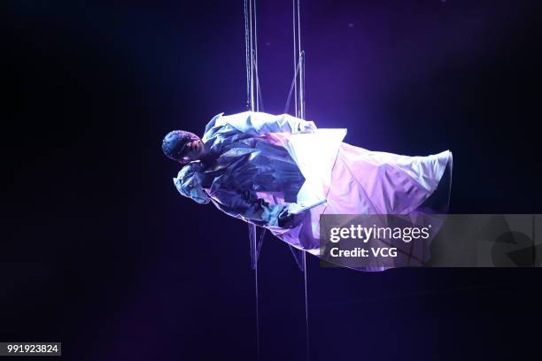 Singaporean singer JJ Lin performs onstage during his 'Sanctuary' world tour concert at Guangxi Sports Center on June 30, 2018 in Nanning, Guangxi...