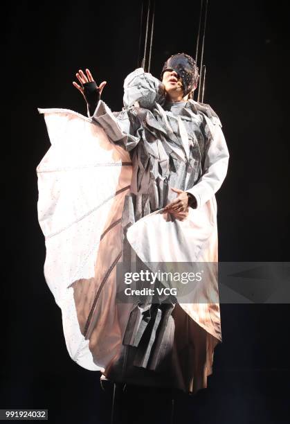 Singaporean singer JJ Lin performs onstage during his 'Sanctuary' world tour concert at Guangxi Sports Center on June 30, 2018 in Nanning, Guangxi...