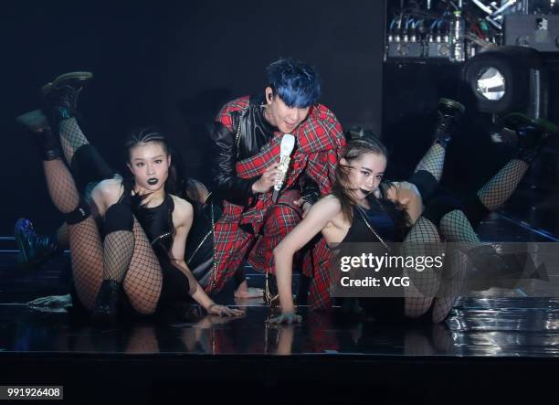 Singaporean singer JJ Lin performs onstage during his 'Sanctuary' world tour concert at Guangxi Sports Center on June 30, 2018 in Nanning, Guangxi...