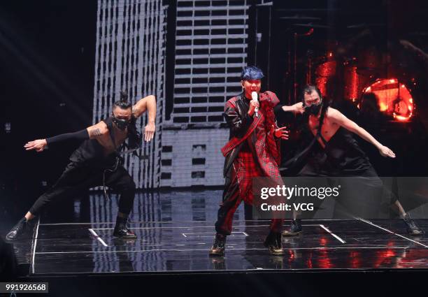 Singaporean singer JJ Lin performs onstage during his 'Sanctuary' world tour concert at Guangxi Sports Center on June 30, 2018 in Nanning, Guangxi...