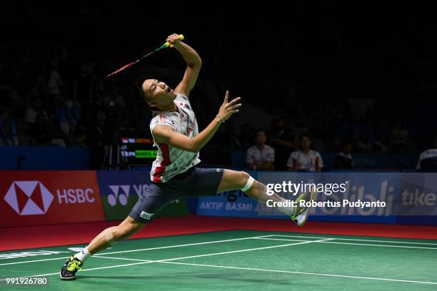 Kento Momota of Japan competes against Anthony Sinisuka Ginting of Indonesia during the Men's Singles Round 2 match on day three of the Blibli...