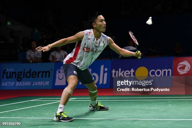 Kento Momota of Japan competes against Anthony Sinisuka Ginting of Indonesia during the Men's Singles Round 2 match on day three of the Blibli...
