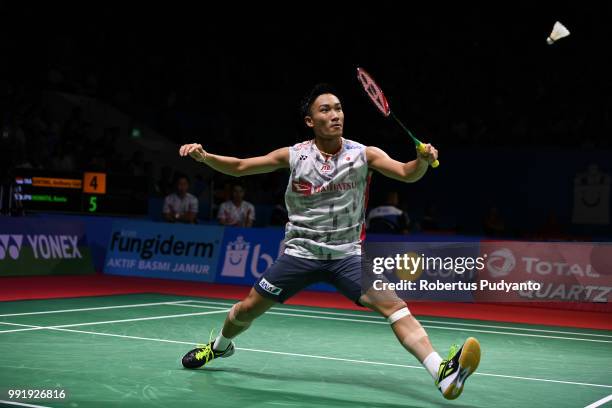 Kento Momota of Japan competes against Anthony Sinisuka Ginting of Indonesia during the Men's Singles Round 2 match on day three of the Blibli...