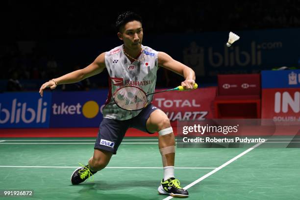 Kento Momota of Japan competes against Anthony Sinisuka Ginting of Indonesia during the Men's Singles Round 2 match on day three of the Blibli...